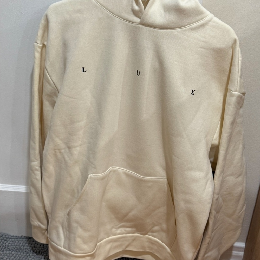 Lux Cream Hoodie with Black-and-Cream Reclining Figure Graphic